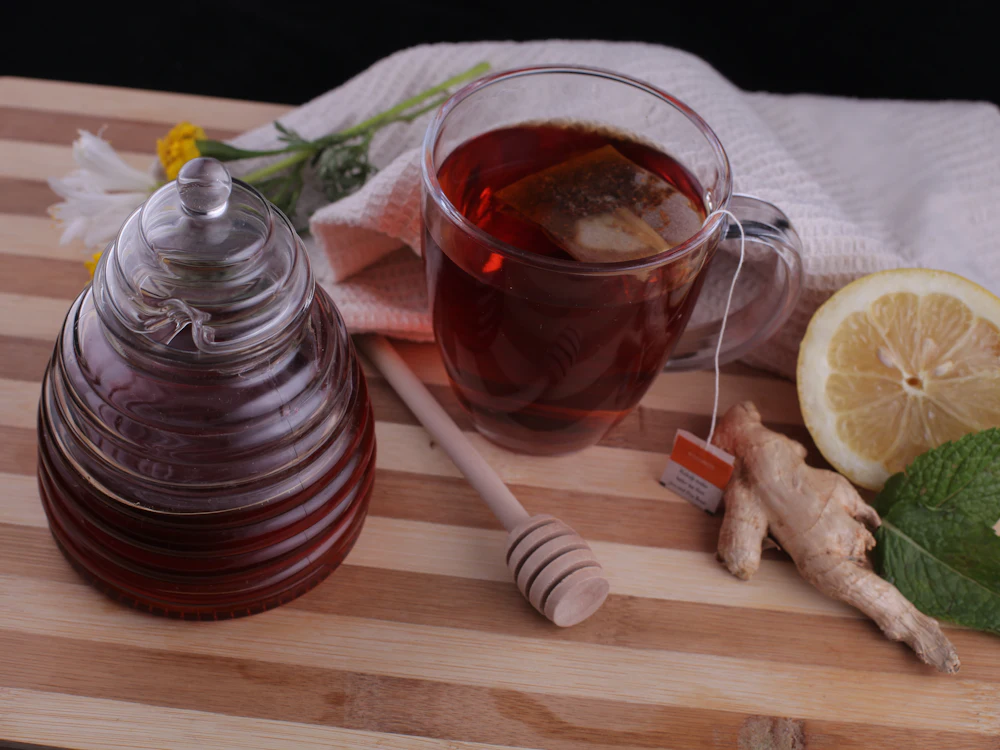 Honey, lemon and ginger tea on a wooden board