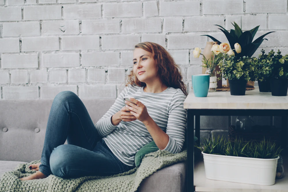 Woman relaxing on her sofa at home